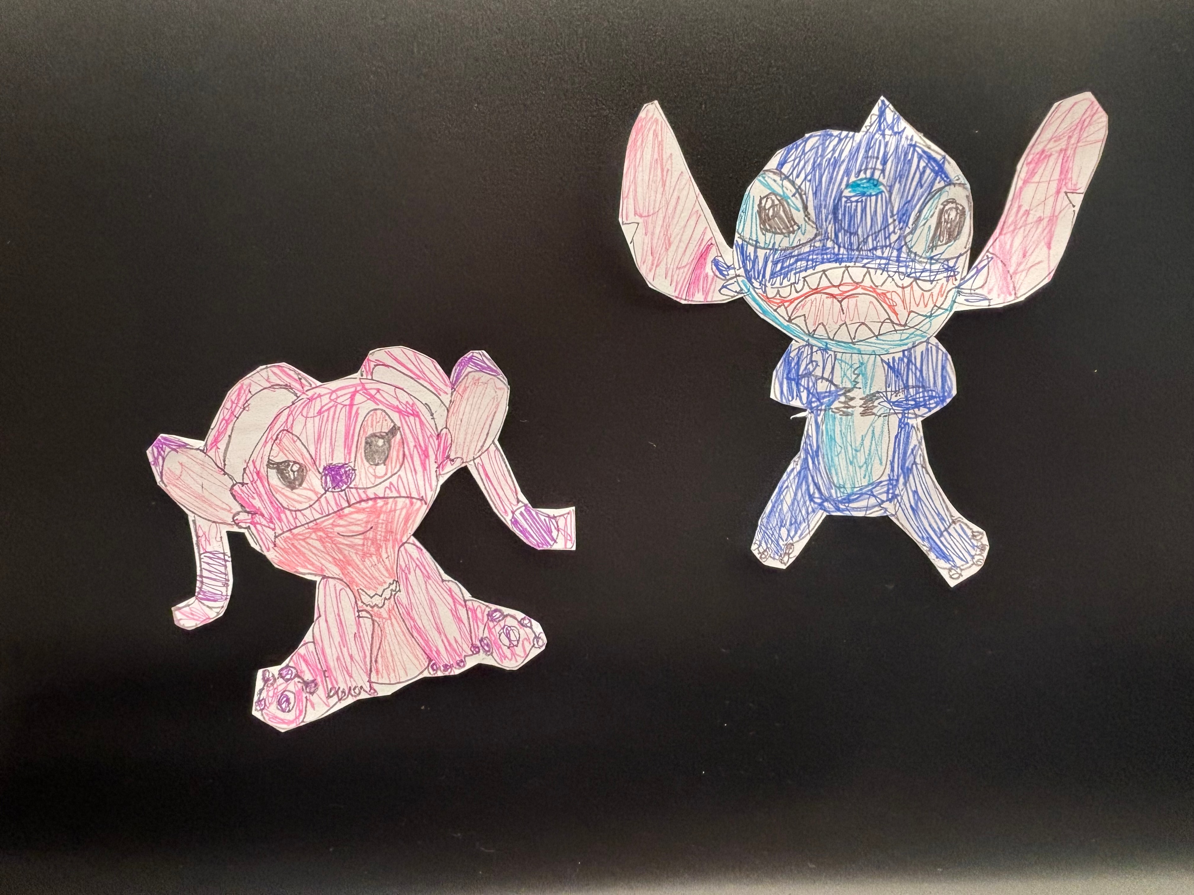 Hand-drawn Angel and Stitch paper cutout characters by Makayla Starr