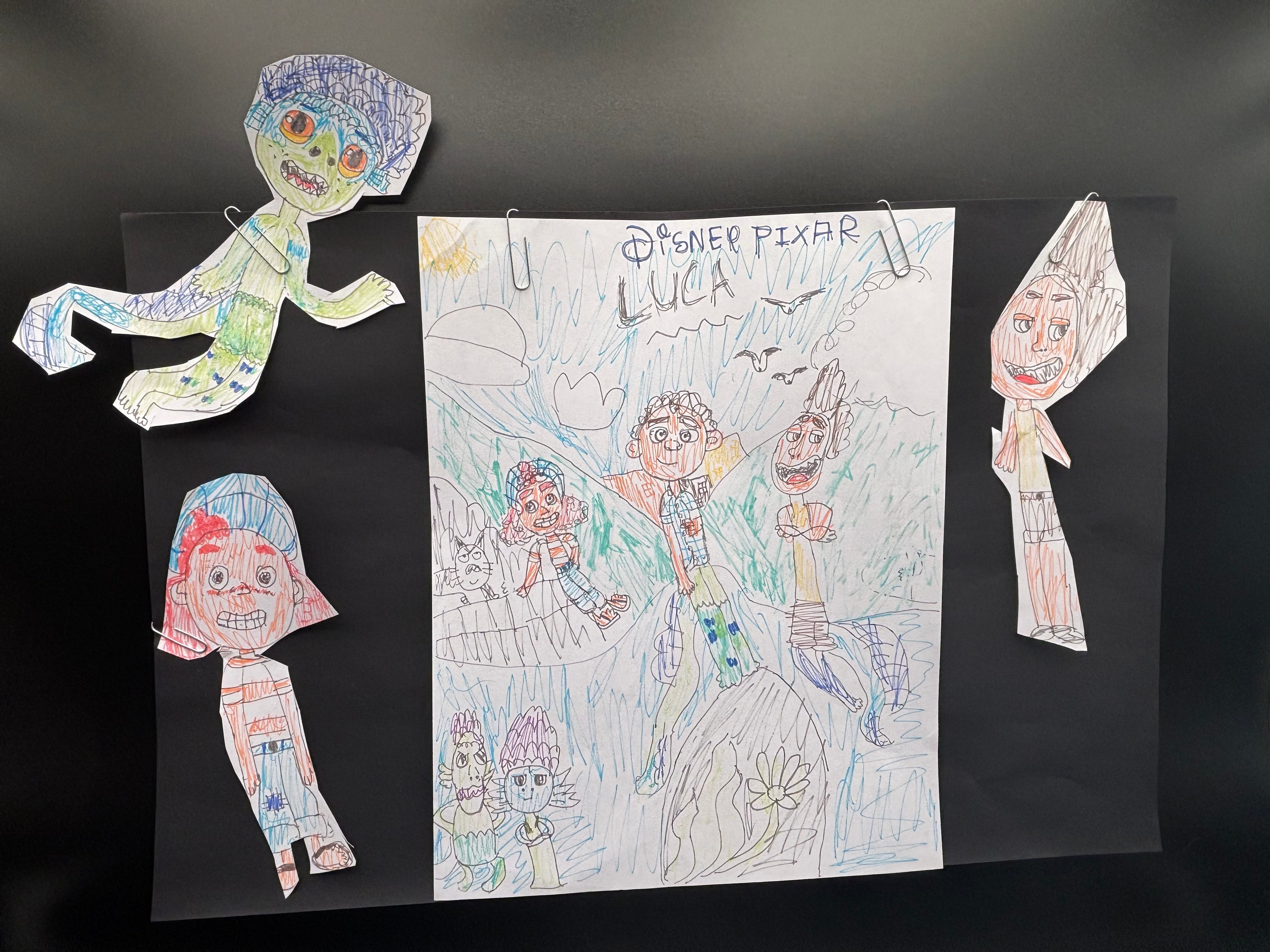 Disney Pixar Luca scene with hand-drawn paper cutout characters by Makayla Starr