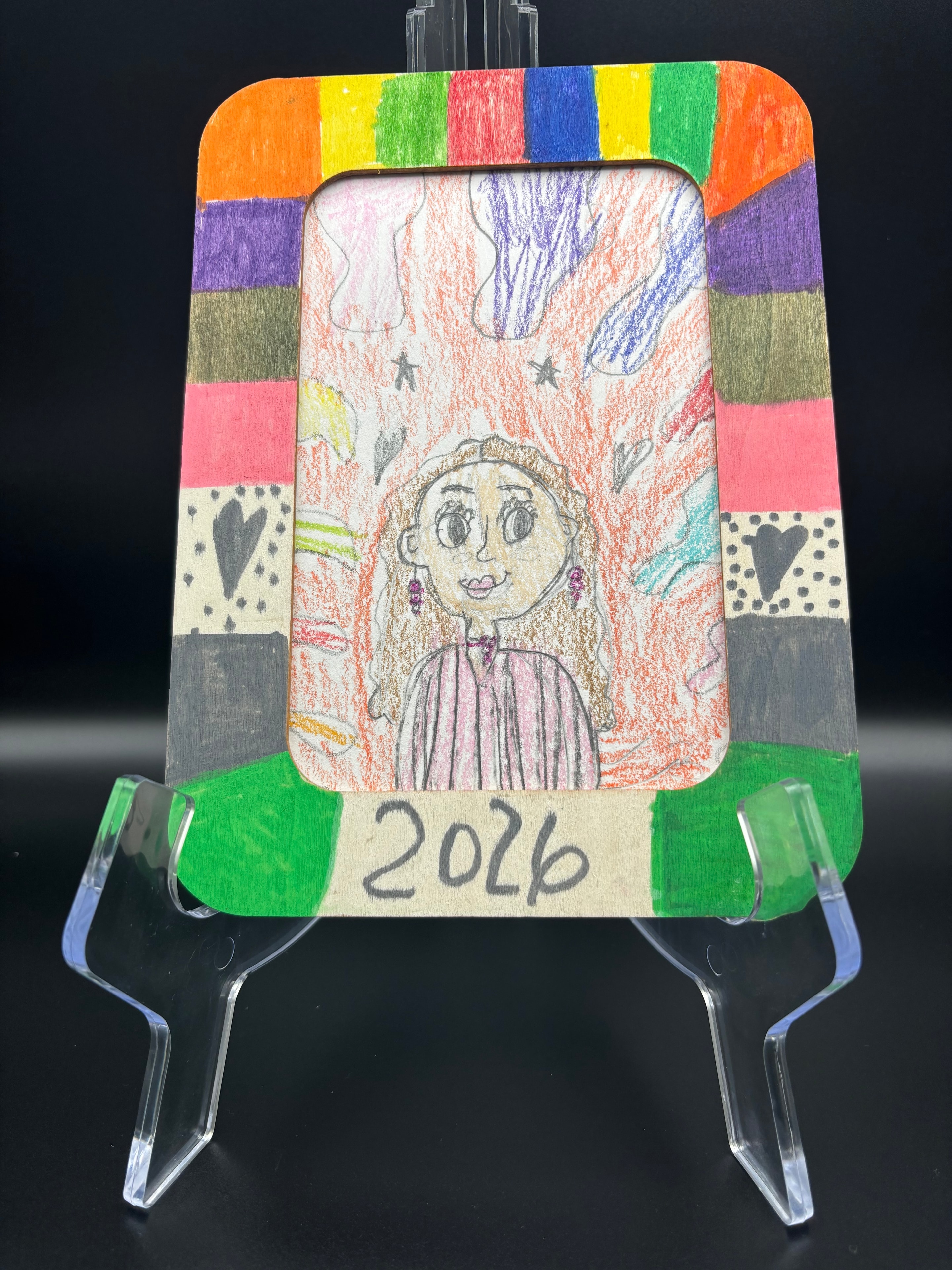 Colorful handmade framed portrait drawing by Makayla Starr, 2026